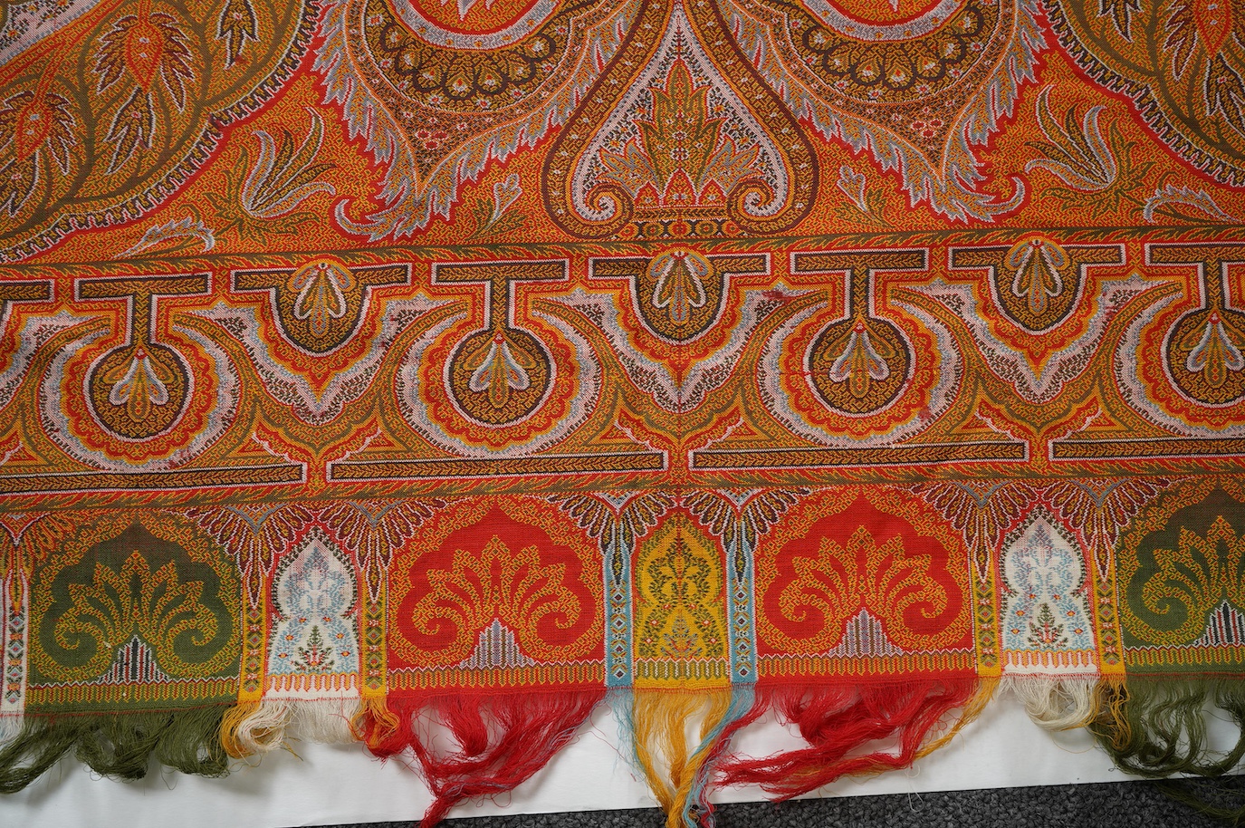 A French possibly Lyon, 19th century ornate silk and fine wool woven Paisley patterned shawl. Woven in polychromes coloured silks and wools on a jacquard loom, using an array of punch cards to create this elaborate desig